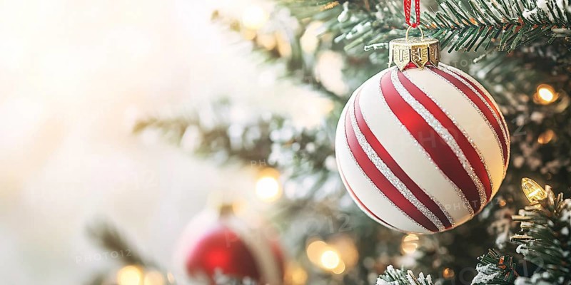 Christmas banner with bauble ornament with red and white stripes on tree with copy space. Generative AI, AI generated