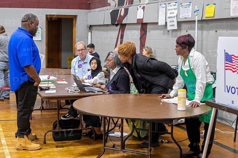 Detroit, Michigan USA, 5 November 2024, Election officials study their compouter as voters cast ballots in the 2024 presidential election at Bethany Lutheran Church