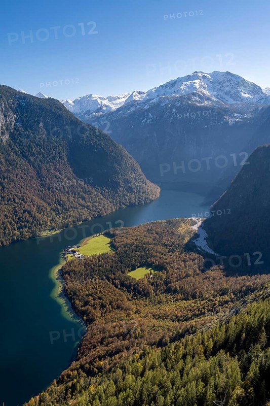 View of the Königssee with St. Bartholomä church, from the Rinnkendlsteig mountain hiking trail, autumn forest and snow-covered mountains, Berchtesgaden National Park, Berchtesgadener Land, Upper Bavaria, Bavaria, Germany, Europe