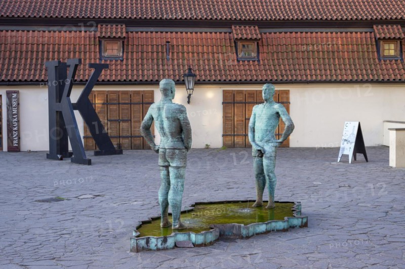 Two male figures peeing, sculpture by the artist David Cerny in front of the Franz Kafka Museum, Prague, Czech Republic, Europe