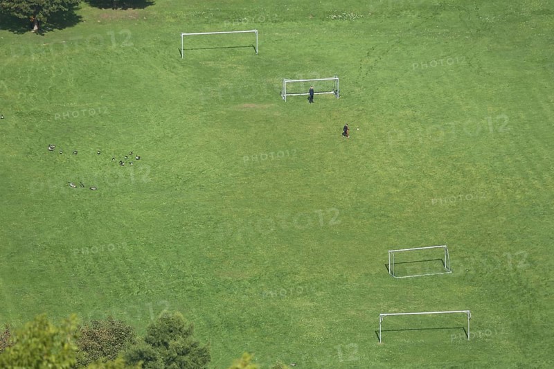 View from Nassau Castle to football field with Tor tor and two players in Lahntal, playground, view from above, playground, empty, lawn, leisure, football, Nassau, Rhineland-Palatinate, Germany, Europe