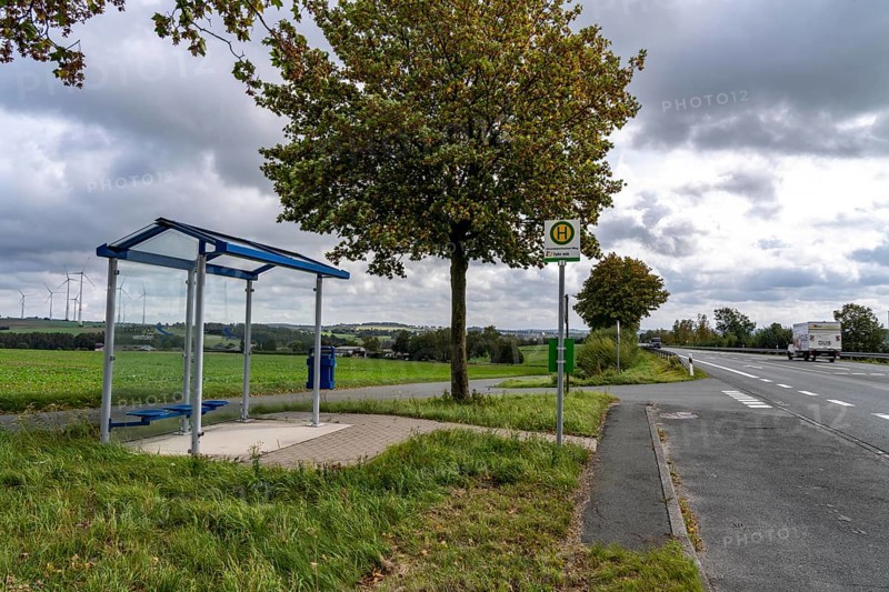 Bus stop in the countryside, on the B68, new, modern bus shelter, line to Warburg, Ostwestfalen Lippe, bus route S 85, Grundsteinheimer Weg stop, north of Lichtenau, Verkehrsverbund fahr mit - Mobil im Hochstift, North Rhine-Westphalia, Germany, Europe