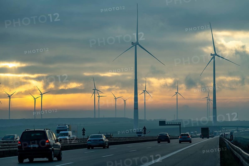 A44 motorway, near Jüchen, crosses the Garzweiler open-cast lignite mining area, wind farm along the motorway, sunrise, North Rhine-Westphalia, Germany, Europe
