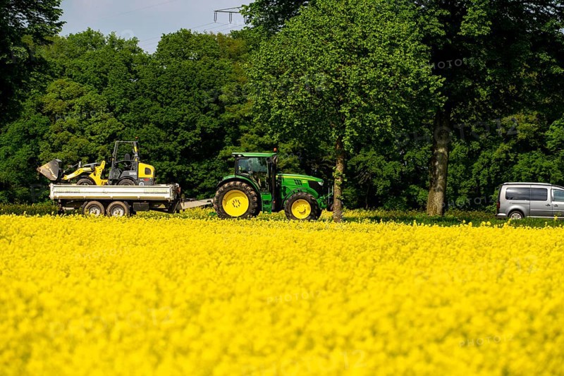 Landscape on the Lower Rhine, Tractor with agricultural machine on the B57 federal road, between Xanten and Kalkar, Road traffic, North Rhine-Westphalia, Germany, Europe
