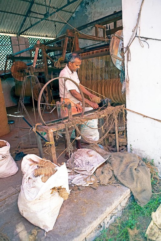 Indian worker winding coils in the Labourers Coir Mats and Mattings Cooperation, coir mat production, Muhamma, Alappuzha, Kerala, India, Asia