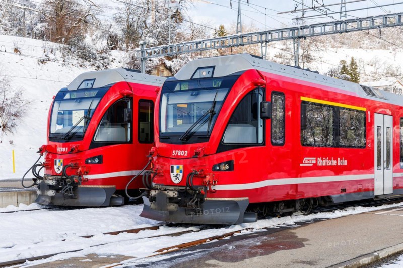 Rhaetian Railway trains on the Albula railway Stadler Rail passenger train at Filisur station, Switzerland, Europe