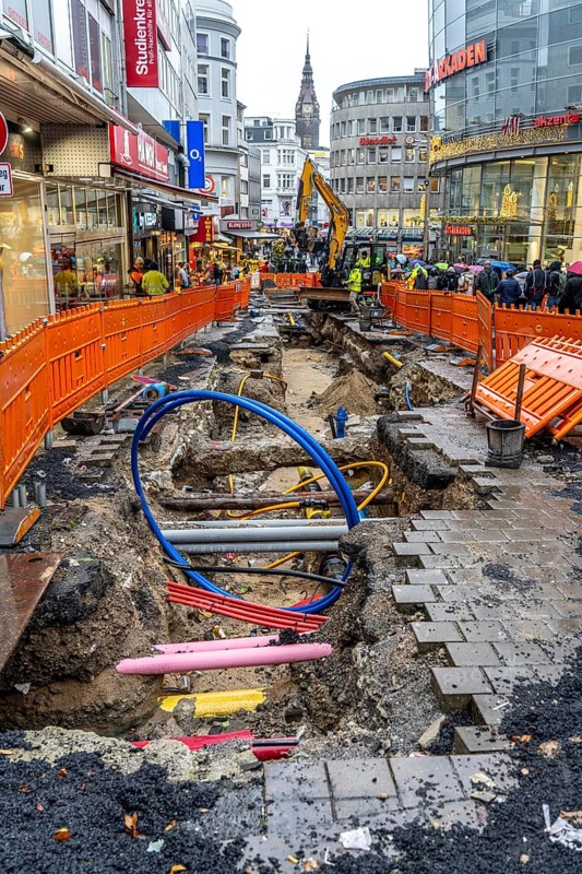 Construction site in the city centre of Wuppertal, laying of new pipelines, various supply lines exposed, Alte Freiheit street, North Rhine-Westphalia, Germany, Europe