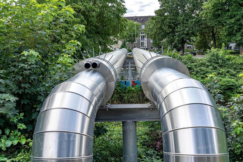 New STEAG district heating pipeline in Essen, over the railway tracks of the S6 line in Essen-Süd, part of the new 12 km long eastern route through the city, North Rhine-Westphalia, Germany, Europe
