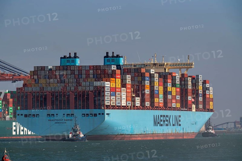 Container ship of the shipping company Maersk Line, Maastricht Maersk, leaving the harbour, towed by two tugs, Euromax Container Terminal, container freighter, in the seaport of Rotterdam, Yangtzehaven, Netherlands, deep-sea port Maasvlakte 2, on an artificial land area off the original coastline