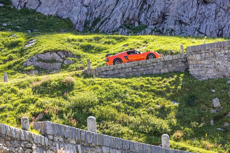 La Tremola, the world-famous serpentine road through the Val Tremolo, Switzerland's longest road monument with 24 hairpin bends. A popular leisure activity for owners of sports cars or vintage cars is the tour over the winding Alpine pass. Airolo, Canton Ticino, Switzerland, Europe