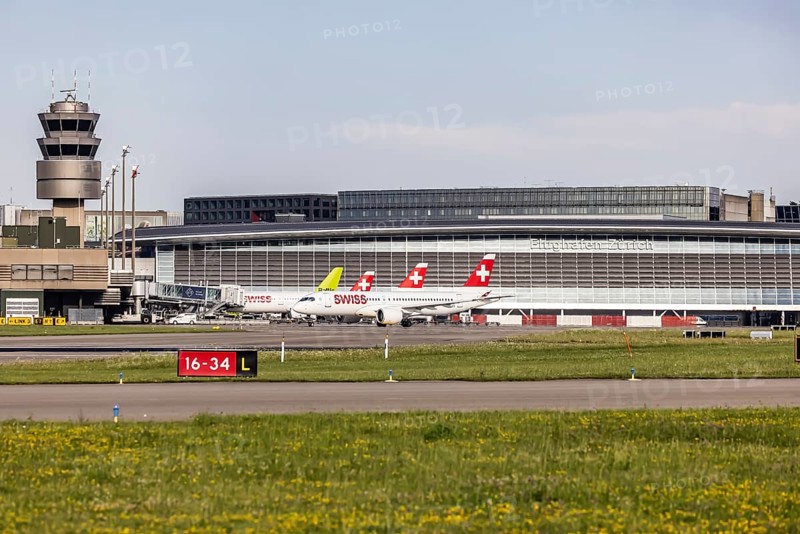 Swiss airline aircraft at Zurich Airport. Terminal and tower. Zurich, Switzerland, Europe