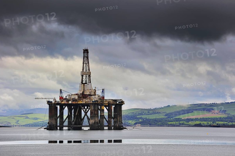 Oil rig, oil drilling platform waiting to be repaired in Cromarty Firth near the port of Invergordon, Easter Ross, Ross and Cromarty, Highland, Scotland, United Kingdom, Europe