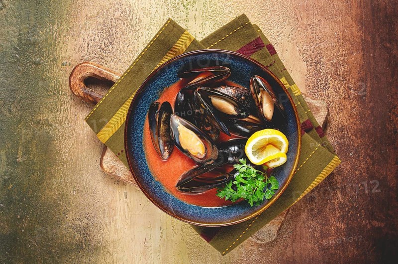 Fra Diavolo mussels, mussels in tomato sauce, Italian dish, on the table, top view, homemade, no people