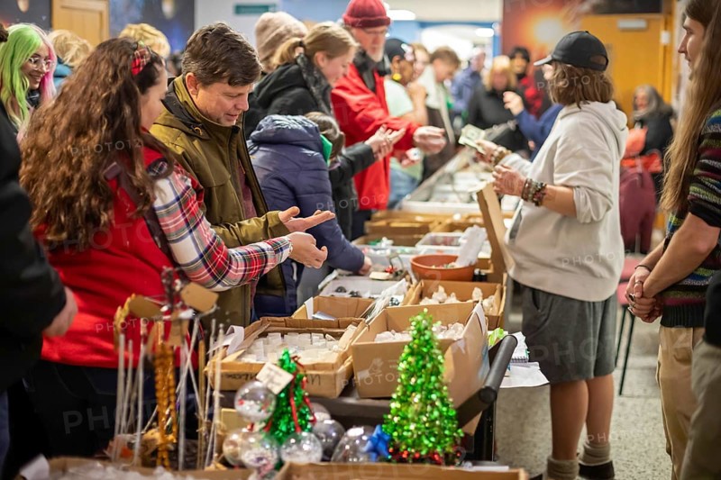 Detroit, Michigan - Visitors look over rocks and minerals at Wayne State University's Geology Mineral Museum on Noel Night. The annual Noel Night at the start of the holiday season in Detroit features open houses by arts and cultural institutions, churches, and small businesses.