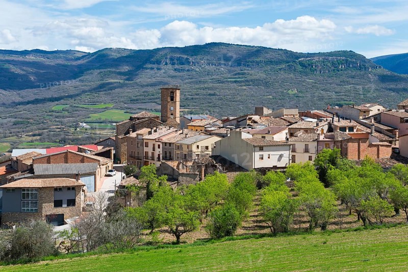 A picturesque village with a clock tower in a mountainous landscape under a clear blue sky, Guardia de Noguera, Lleida province, Catalonia, Spain, Europe