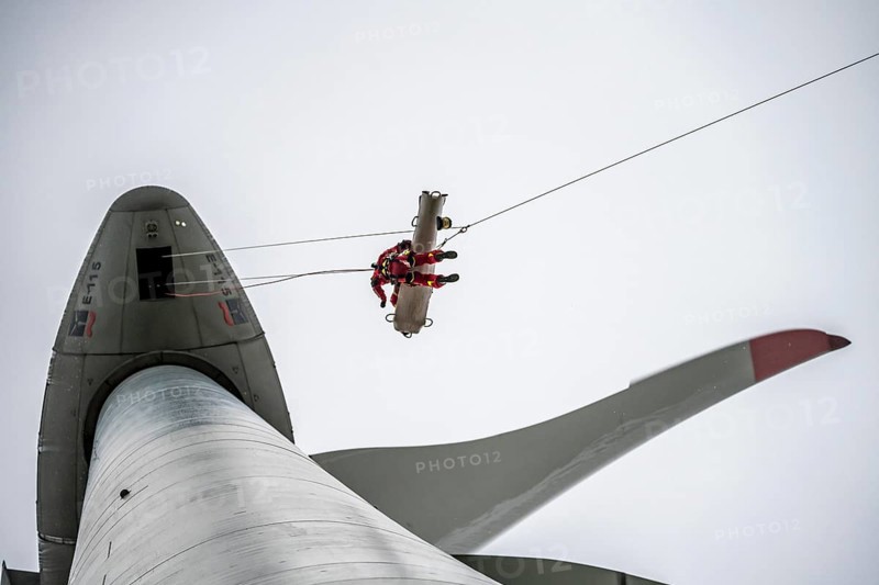 Height rescuers from the Oberhausen professional fire brigade practise abseiling from a wind turbine from a height of 150 metres, rescuing an injured person, technician, from the nacelle, Issum, North Rhine-Westphalia, Germany, Europe
