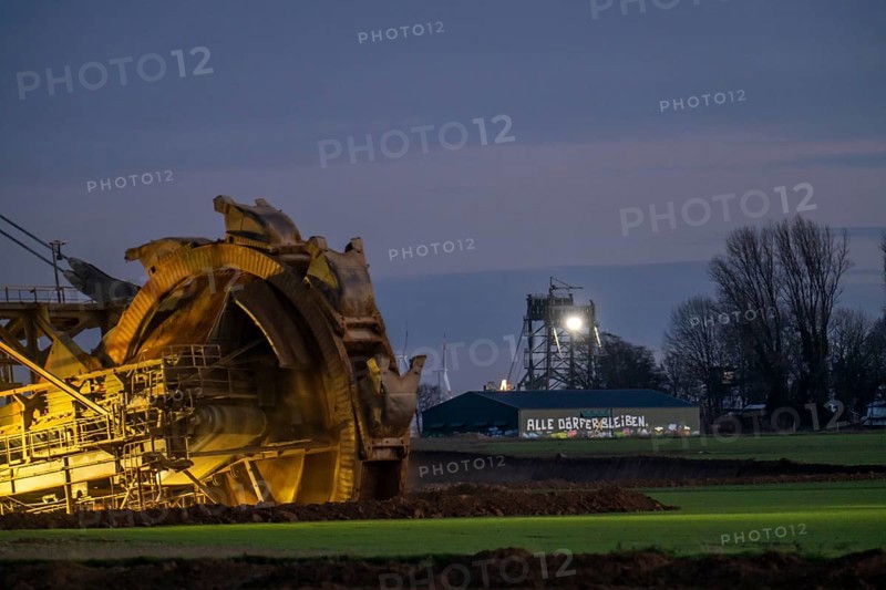 Two excavators are working around the hamlet of Lützerath, occupied by climate activists, the remains of the village are to make way for lignite mining, an eviction is imminent, North Rhine-Westphalia, Germany, Europe