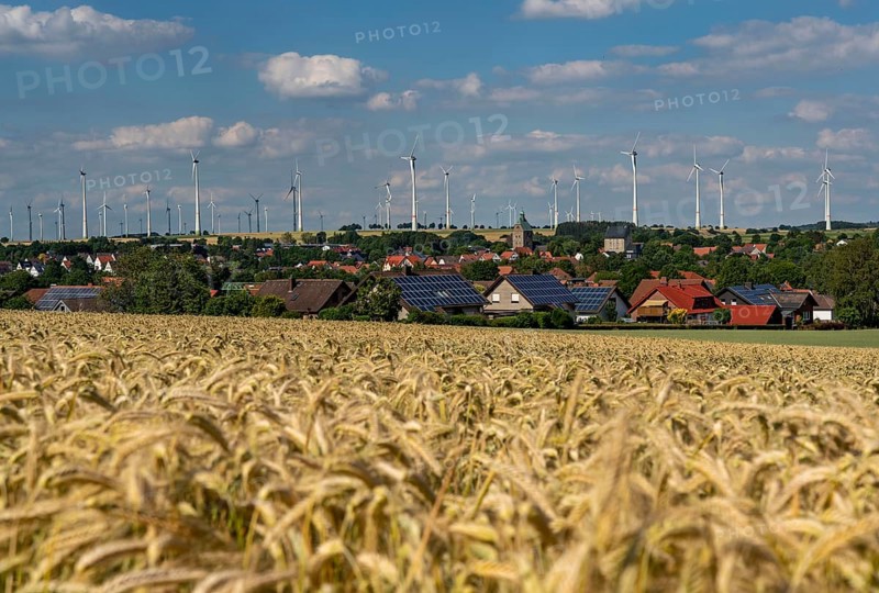Wind farm near the East Westphalian town of Energiestadt Lichtenau, many residential buildings with photovoltaic systems on the roofs, over 80 wind turbines on this hill, in total there are more than 200 wind turbines around the town, producing 9 times more electricity than the town itself consumes, the rest is fed into the grid, North Rhine-Westphalia, Germany, Europe