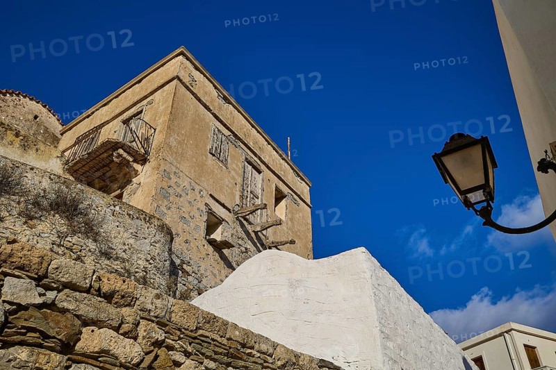 Stone walls and lamp in a Mediterranean village under a blue sky, Colourful mountain village, Morning light, Olymbos, Karpathos, Dodecanese, Greek Islands, Greece, Europe