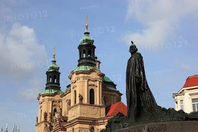 Jan Hus Monument on Old Town Square and the baroque St Nicholas Church, Prague, Czech Republic, Europe