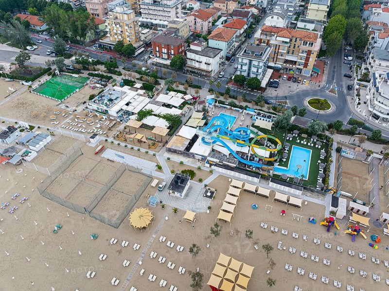 Bathing beach in Rimini. Bathing beach on the Adriatic in bad weather. All deckchairs are free. Drone photo. Rimini, Province of Rimini, Italy, Europe