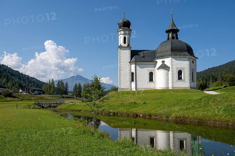 Seekirchl mi reflection, Heiligkreuzkirche, view from the parish hill, Seefeld, Tyrol, Austria, Europe