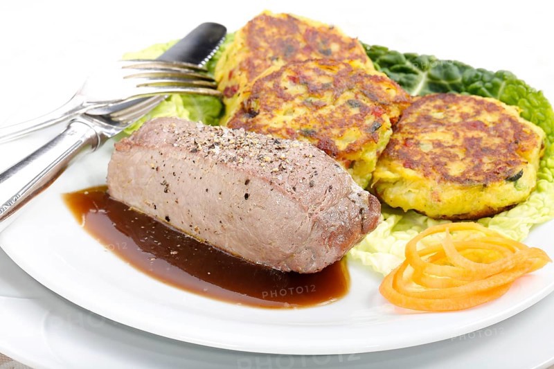 Swabian cuisine, medallions of wild boar with savoy cabbage cakes, meat dish, roasted, hearty, home cooking, typical Swabian, arranged on a plate, traditional cuisine reinterpreted, food photography, studio, Germany, Europe