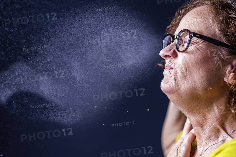A woman sneezes. Berlin, 09.08.2024