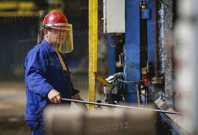 A worker stands at a boiler during a galvanising process. Taken during a press event at The Coatinc Company in Siegen, 22/08/2024