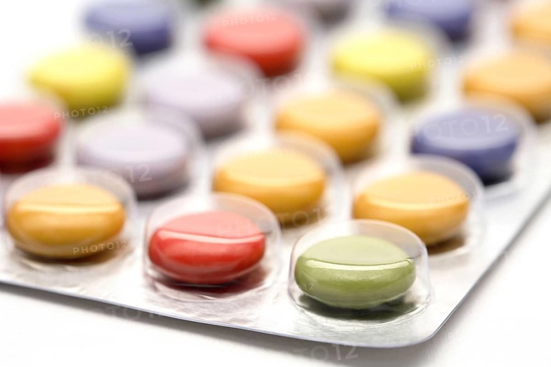 Colourful tablets packed in plastic, tablet addiction, drug addiction, studio