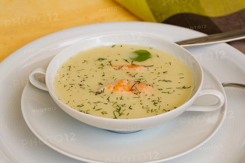Southern German cuisine, sorrel soup with char, freshwater fish, soup served in soup bowl, herbs, fresh sorrel, blood sorrel, dill, toothpick, savoury, salty, traditional cuisine, food photography, studio, Germany, Europe