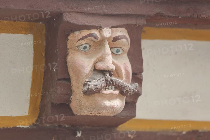 Wood carving with envious head symbolising unchastity, fornication, lust, lechery, grimace, allegory, allegory, detail, wooden figure, House of the Seven Vices, Brückenstraße, Old Town, Limburg, Hesse, Germany, Europe