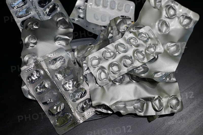 Symbolic photo on the subject of medication. Empty blister packs of various tablets lying on a table. Berlin, 27.07.2024