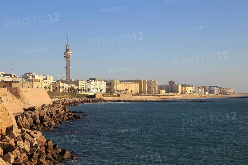 Coastal view east of rock armour coastal defences near city centre, Cadiz, Spain, Europe