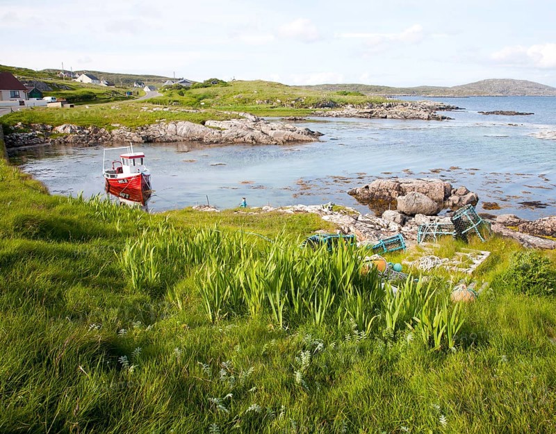 Small fishing boat at moorings on the east coast of Barra, Outer Hebrides, Scotland, UK