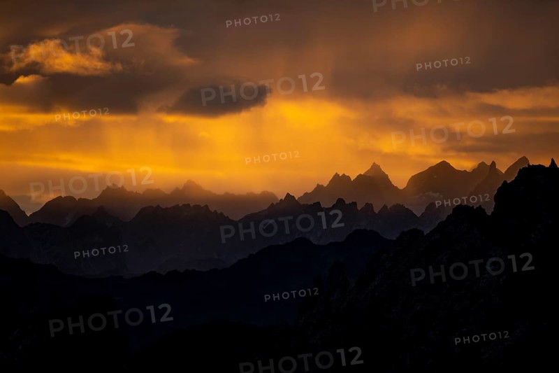 Montafon mountains with dramatic cloudy sky at sunrise, Tschagguns, Rätikon, Montafon, Vorarlberg, Austria, Europe