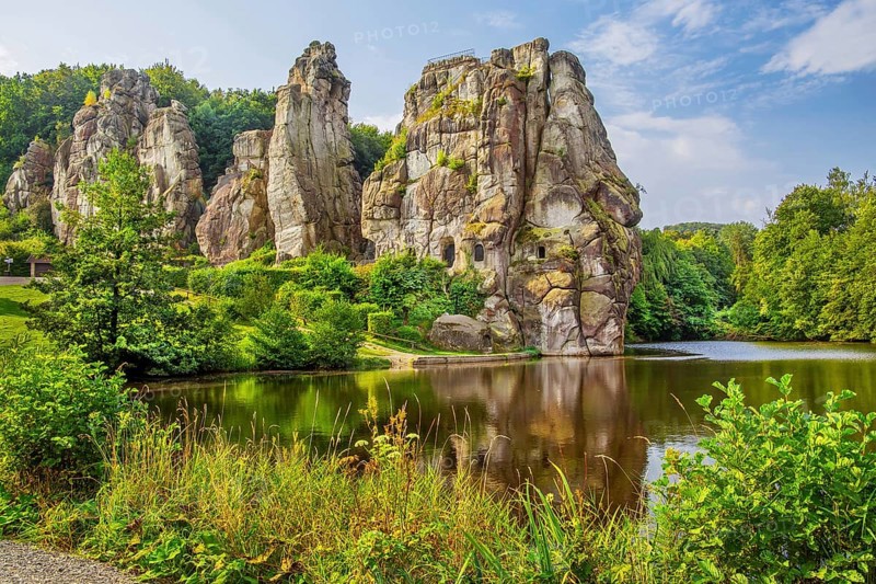 Externsteine at the Wiembecketeich, sandstone rock formation. Horn-Bad Meinberg, Teutoburg Forest, North Rhine-Westphalia, Germany, Europe