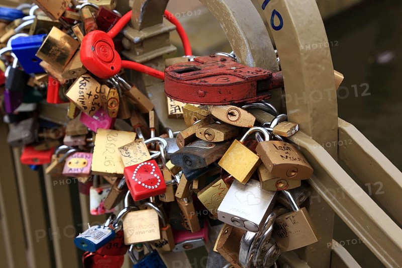 Lover's lock on a railing, love lock is a padlock which, according to custom, is attached to bridges by lovers to symbolically seal their eternal love, Prague, Czech Republic, Europe