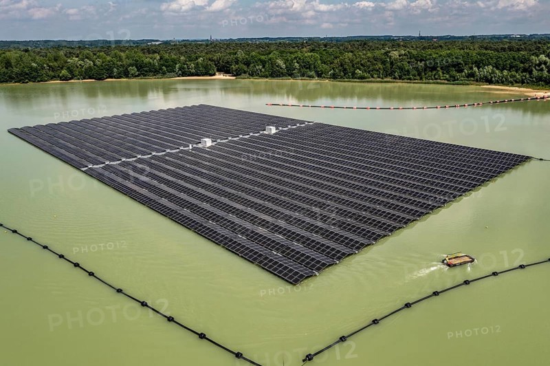 Germany's largest floating solar power plant on the Silbersee III, a quarry pond no longer used for sand mining, near Haltern am See, operated by Quarzwerke GmbH, around 5800 solar modules, on an area of a good 2 football pitches, generate 3.1 megawatts of power, the company uses the electricity itself on weekdays, at weekends it flows into the public grid, North Rhine-Westphalia, Germany, Europe