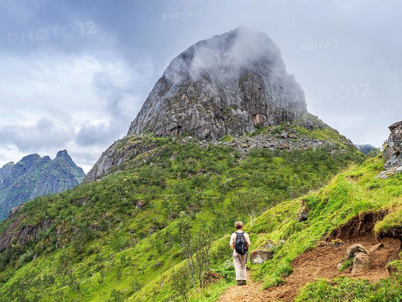 Hiking woman on path up to Hamarøyskaftet, roundtrip Landstrykerstien, Hamarøy island, Norway, Europe