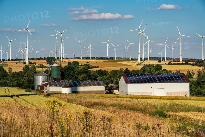 Wind farm near the East Westphalian town of Energiestadt Lichtenau, agricultural business with photovoltaic system, over 80 wind turbines on this hill, in total there are more than 200 wind turbines around the town, producing 9 times more electricity than the town itself consumes, the rest is fed into the grid, North Rhine-Westphalia, Germany, Europe