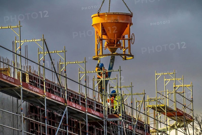 Concrete work, at dusk, on a large construction site building a residential and commercial complex, North Rhine-Westphalia, Germany, Europe