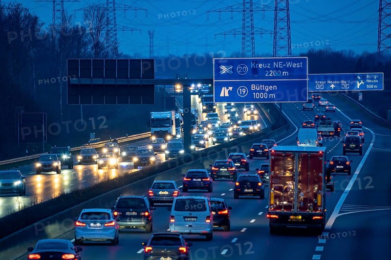 A57 motorway near Kaarst in the Rhine district of Neuss, view in the direction of the Büttgen junction, heavy evening traffic, overhead power lines, along the motorway, North Rhine-Westphalia, Germany, Europe