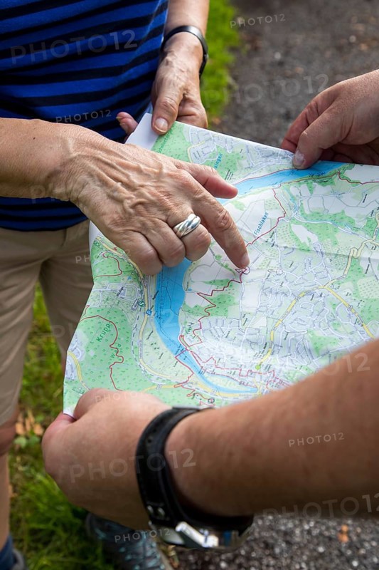 Hikers on the Baldeneysteig, a 26-kilometre urban hiking trail around and above Lake Baldeney in Essen Viewpoint Map Cliff, Germany, Europe