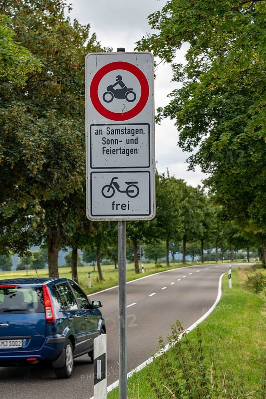 Prohibition sign, driving bans for motorbikes on weekends and public holidays, Eifel, Steckenborn, North Rhine-Westphalia, Germany, Europe