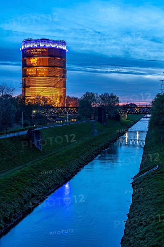 Neue Mitte Oberhausen, Gasometer exhibition hall, after renovation, Emscher River, evening lighting, exhibition The Fragile Paradise, North Rhine-Westphalia, Germany, Europe