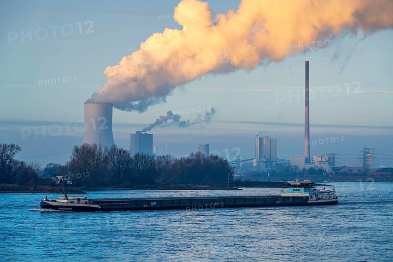 Cooling tower of the coal-fired power plant Duisburg-Walsum, operated by STEAG and EVN AG, 181 metres high, power plant unit 10, water vapour cloud, container cargo ship on the Rhine, Duisburg, North Rhine-Westphalia, Germany, Europe