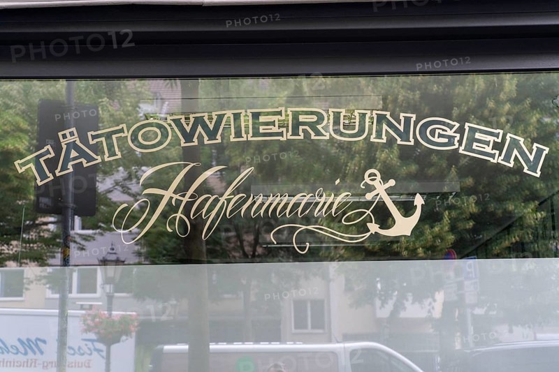 Tattoo studio Hafenmarie, on Neumarkt in the harbour district of Duisburg-Ruhrort, North Rhine-Westphalia, Germany, Europe