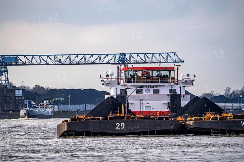 Pushed barge with coal on the Rhine near Duisburg, in the background the NIAG Rhine harbour in Rheinberg-Orsoy, North Rhine-Westphalia, Germany, Europe