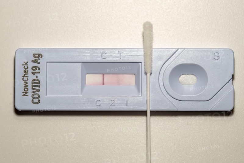 Covid-19 rapid test, antigen test, the abrasion of the swab is dissolved in a liquid and applied to the test device, after a few minutes the test device shows the result by a black line, whether the person has tested positive or negative, here a negative result